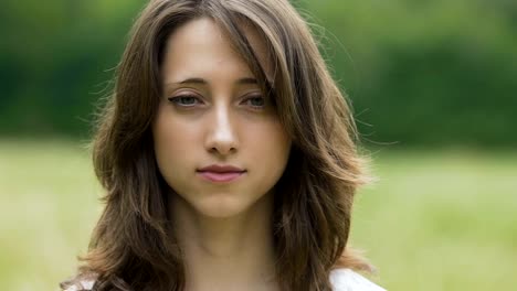 Beautiful-woman-opens-her-eyes-portrait,-female-after-meditation-looks-in-camera