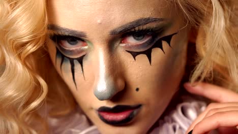 Portrait-of-young-beautiful-woman-with-make-up-skeleton-on-her-face.-Halloween.