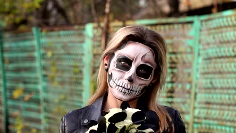 A-bride-with-a-creepy-skull-makeup-for-Halloween-in-an-abandoned-city.