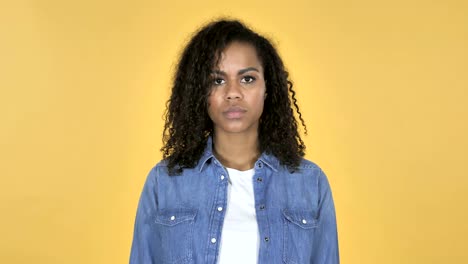 Sad-Upset-African-Girl-Isolated-on-Yellow-Background