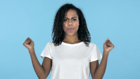 Screaming-Angry-African-Girl-Isolated-on-Blue-Background