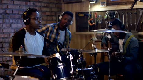 Young-musicians-rehearsing-in-garage