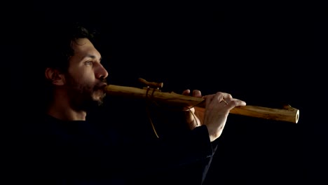 man-playing-the-flute