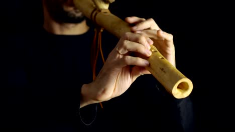 man-playing-the-flute