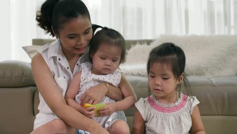 Mother-Reading-Book-with-Daughters