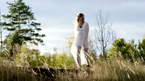 Woman-with-make-up-of-dead-bride-for-Halloween-dressed-in-white-wedding-gown.-4K