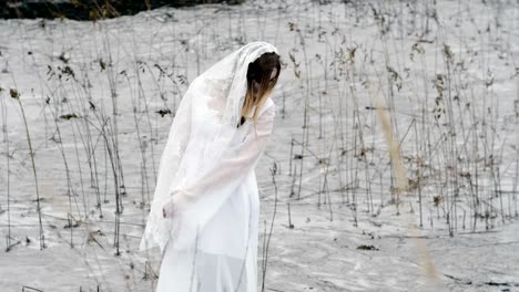 The-young-woman-with-scary-make-up-of-dead-bride-for-Halloween-in-white-dress.-4K