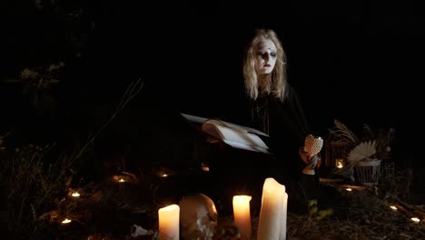halloween.-the-witch-reads-the-spell-from-the-book