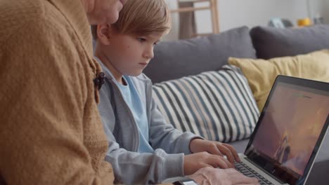 Granddad-and-Grandson-Playing-Computer-Game