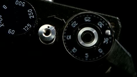 Pressing-film-rewind-button.-Old-camera-closeup-in-slow-motion