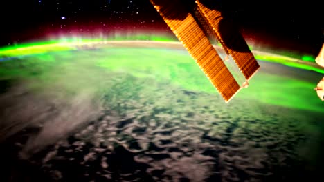 Earth-and-Aurora-Borealis-from-ISS.-Elements-of-this-video-furnished-by-NASA.-8K-Timelapse