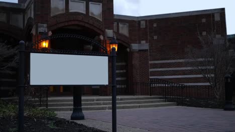 Establishing-shot-of-generic-bricked-Victorian-building-lit-by-lamppost-with-blank-sign-in-front