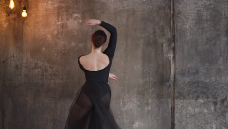 woman-is-engaged-in-ballet-in-a-modern-performance-she-rehearses-the-performance
