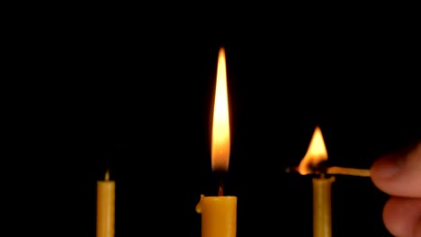 Burning-Candle-With-Black-Background.