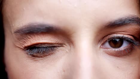 Sad-women-opening-eyes-and-looking-straight-in-camera,-portrait,-brick-wall-in-the-background,-portrait