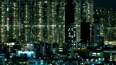 Time-lapse-of-lights-high-rise-apartment-blocks-at-night.-Buildings-Exterior