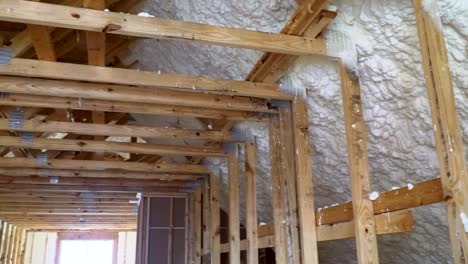 New-home-construction-with-installation-of-attic-with-foam-insulation-the-roof