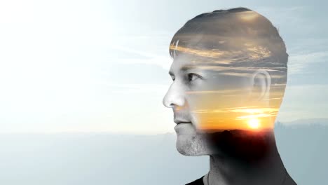 Portrait-of-young-man-with-sunset,-double-exposure
