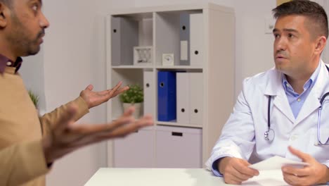 doctor-and-displeased-male-patient-at-clinic