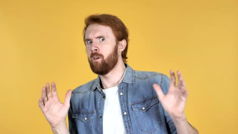 Redhead-Man-Confused-and-Scared-of-Problems-Isolated-on-Yellow-Background