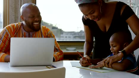 Mother-and-son-drawing-sketch-on-a-paper-on-table-at-home-4k