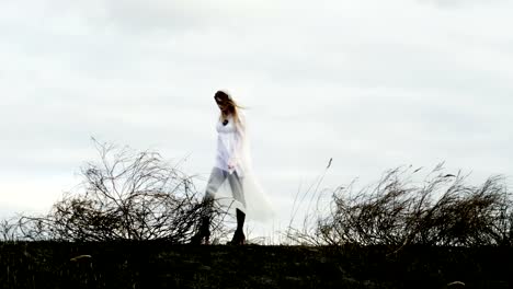 Halloween-makeup.-The-young-woman-in-a-bride-dress-on-the-background-of-sky.-4K