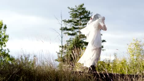 Woman-with-make-up-of-dead-bride-for-Halloween-dressed-in-white-wedding-gown.-4K