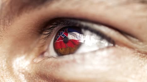 Hombre-con-el-ojo-marrón-de-cerca,-la-bandera-del-estado-de-Mississippi-en-iris,-estados-unidos-de-América-con-movimiento-de-viento.-concepto-de-vídeo