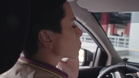 Woman-with-Phone-Driving-into-Parking-Lot