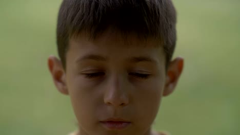 portrait-of-little-sad-desperate-kid-looking-at-camera,-close-up