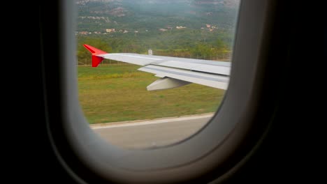 wing-of-the-aircraft-accelerates-on-the-ground-on-the-runway