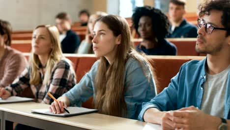 Group-of-Multi-Ethnic-Students-in-Classroom-Taking-Exam/-Test.-Bright-Young-People-Study-at-University.