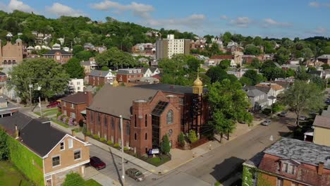 Day-Forward-Aerial-Establishing-Shot-of-Church-in-Small-Town