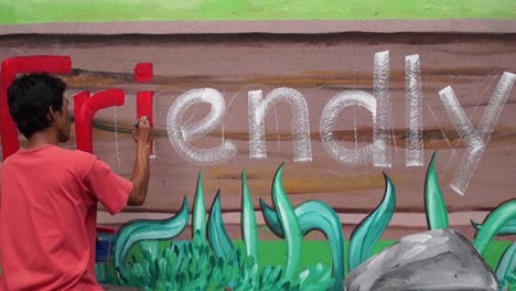 Mural-painter-draws-a-letter-i-on-school-wall.-time-lapse