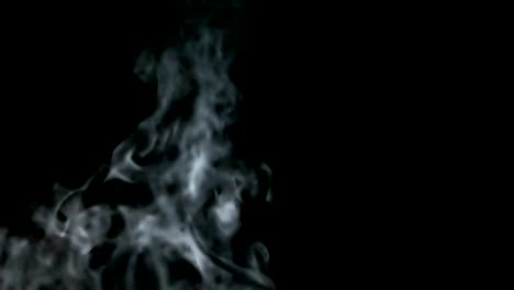 Thick-light-smoke-rises-smoothly-on-a-black-isolated-background.-Great-for-overlay-in-a-video-editor