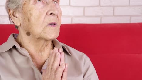 An-elderly-woman-prays.