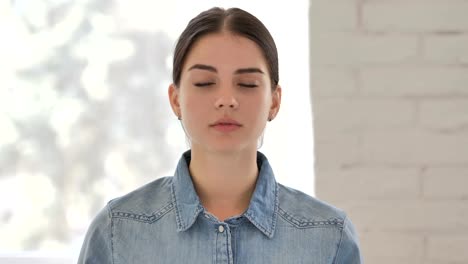 Portrait-of-Sad-Young-Girl-Looking-at-Camera