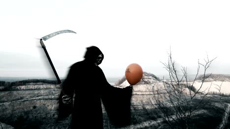 death-with-a-scythe-holds-a--ball