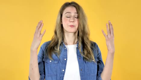 Portrait-of-Pretty-Girl-with-Frustration-and-Anger-on-Yellow-Background