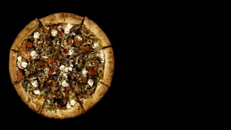 Rotating-pizza-with-smoked-sausage-and-olives-on-a-black-background.-Top-view-center-orientation