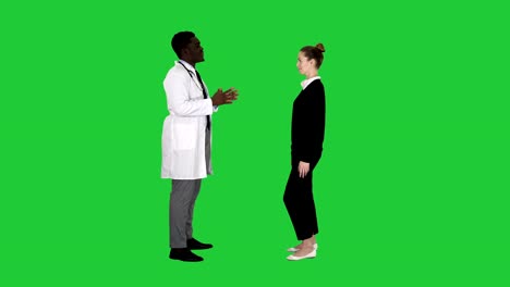 Doctor-telling-good-news-and-patient-leaves-on-a-Green-Screen,-Chroma-Key