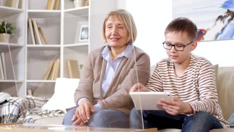 Old-Lady-and-Teenager-Using-Gadgets