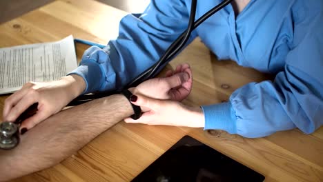 Female-doctor-measure-blood-pressure,-close-up-FullHD