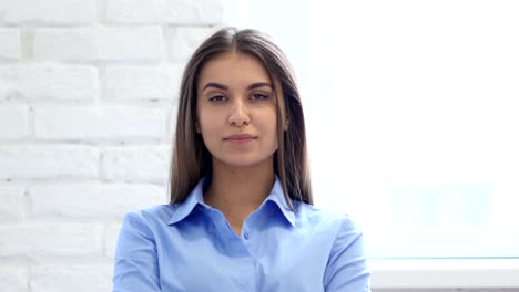 Beautiful-Young-Woman-Yawning-in-Office