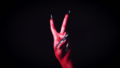 4k-Horror-Halloween-Devil's-Hand-Showing-Peace