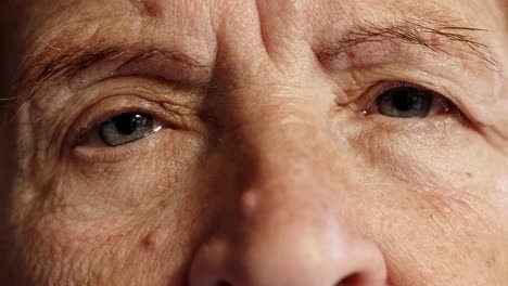 sad-old-woman-opens-her-eyes,close-up-portrait