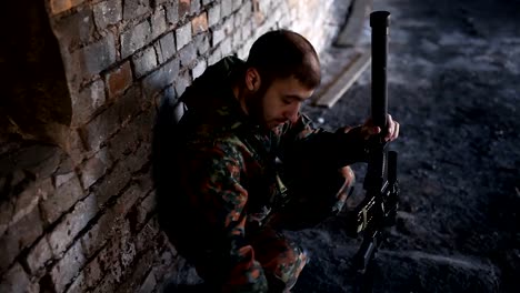 A-thoughtful-soldier,-resting-from-a-military-operation