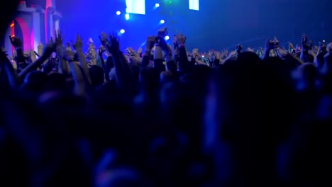 Happy-and-excited-audience-dancing-at-the-concert