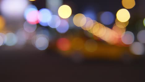 Traffic-jam-on-a-highway-at-night,-out-of-focus