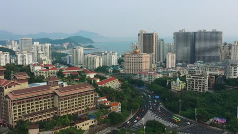 noche-tiempo-hainan-isla-dadunhai-ciudad-tráfico-panorama-aéreo-Bahía-calle-4k-china